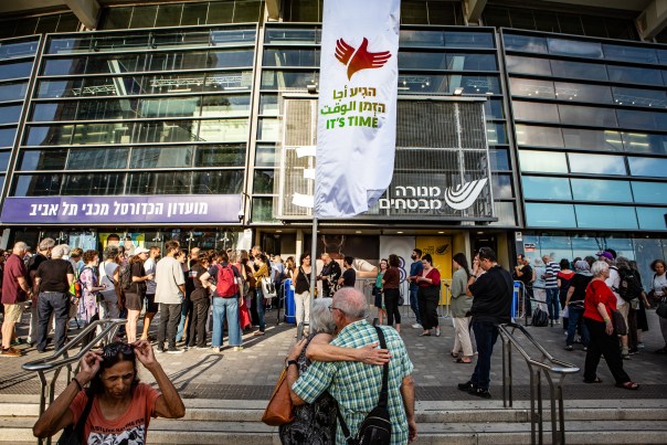 Two people embrace before entering the arena