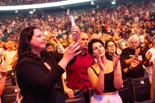 Audience members applauding